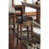 image:imageSignature Design by Ashley Valebeck 1Piece Swivel Barstool 30 InLight Brown