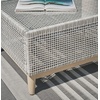 image:imageSignature Design by Ashley Seton Creek Casual Nuvella Weather Resistant Fabric Resin Wicker Swivel Outdoor Bar Height Bar Stool with Cushion Footrest and Armrest Set of 2 Beige amp Light GrayOutdoor Coffee Table