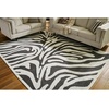 image:imageSignature Design by Ashley Thomwith Contemporary Indoor Washable Zebra Design 8 x 10 Rug with Non Slip Backing Black amp White710 x 101 Rectangular