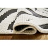 image:imageSignature Design by Ashley Thomwith Contemporary Indoor Washable Zebra Design 8 x 10 Rug with Non Slip Backing Black amp White710 x 101 Rectangular