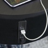 image:imageSignature Design by Ashley Nedman Modern Tempered Glass Tabletop Accent Table with Speaker Shelf USB and Qi Wireless Charging Options Black amp Metallic