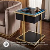 image:imageSignature Design by Ashley Rexwell Modern Glass Top Accent Table with Speaker Wireless Charging LED Lights and USB Ports Black amp Metallic