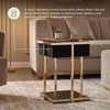 image:imageSignature Design by Ashley Rexwell Modern Glass Top Accent Table with Speaker Wireless Charging LED Lights and USB Ports Black amp Metallic