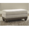 image:imageSignature Design by Ashley Harleson Modern Farmhouse Ottoman with Nailhead Trim Beige